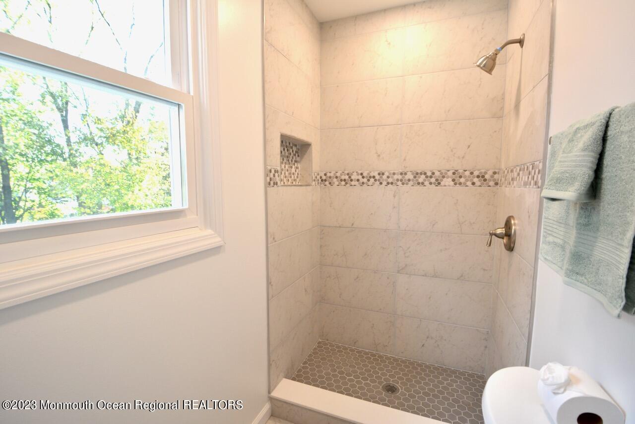 6 Wickatunk Road Manalapan, NJ 07726 - Photo 29 of 35 a bathroom with a shower