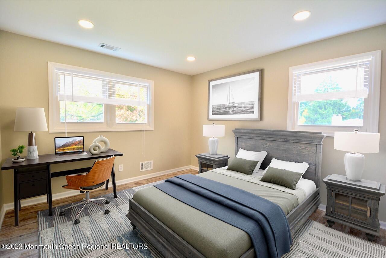 6 Wickatunk Road Manalapan, NJ 07726 - Photo 30 of 35 a bedroom with a bed a table and a window