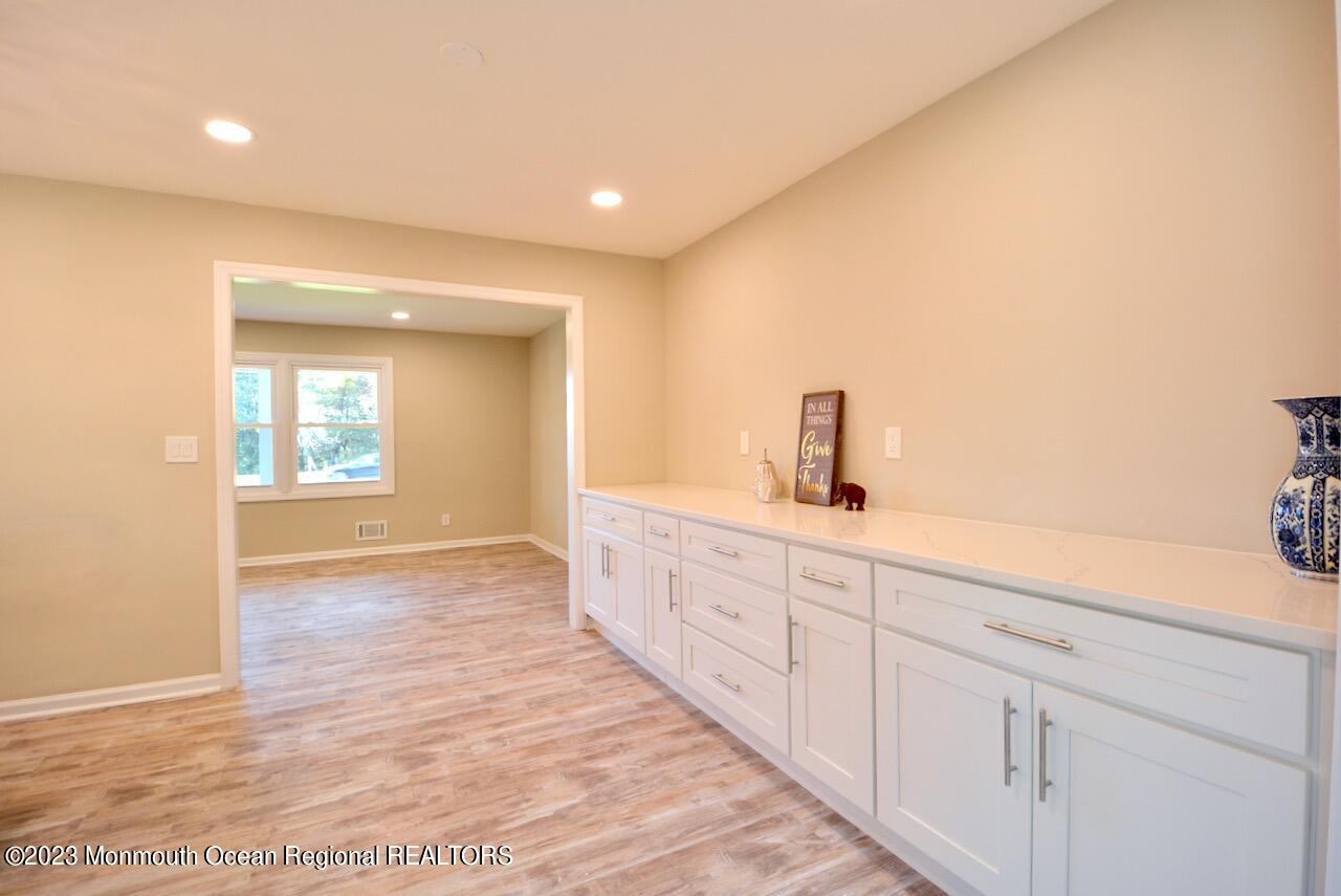 6 Wickatunk Road Manalapan, NJ 07726 - Photo 7 of 35 a bathroom with a sink and a mirror
