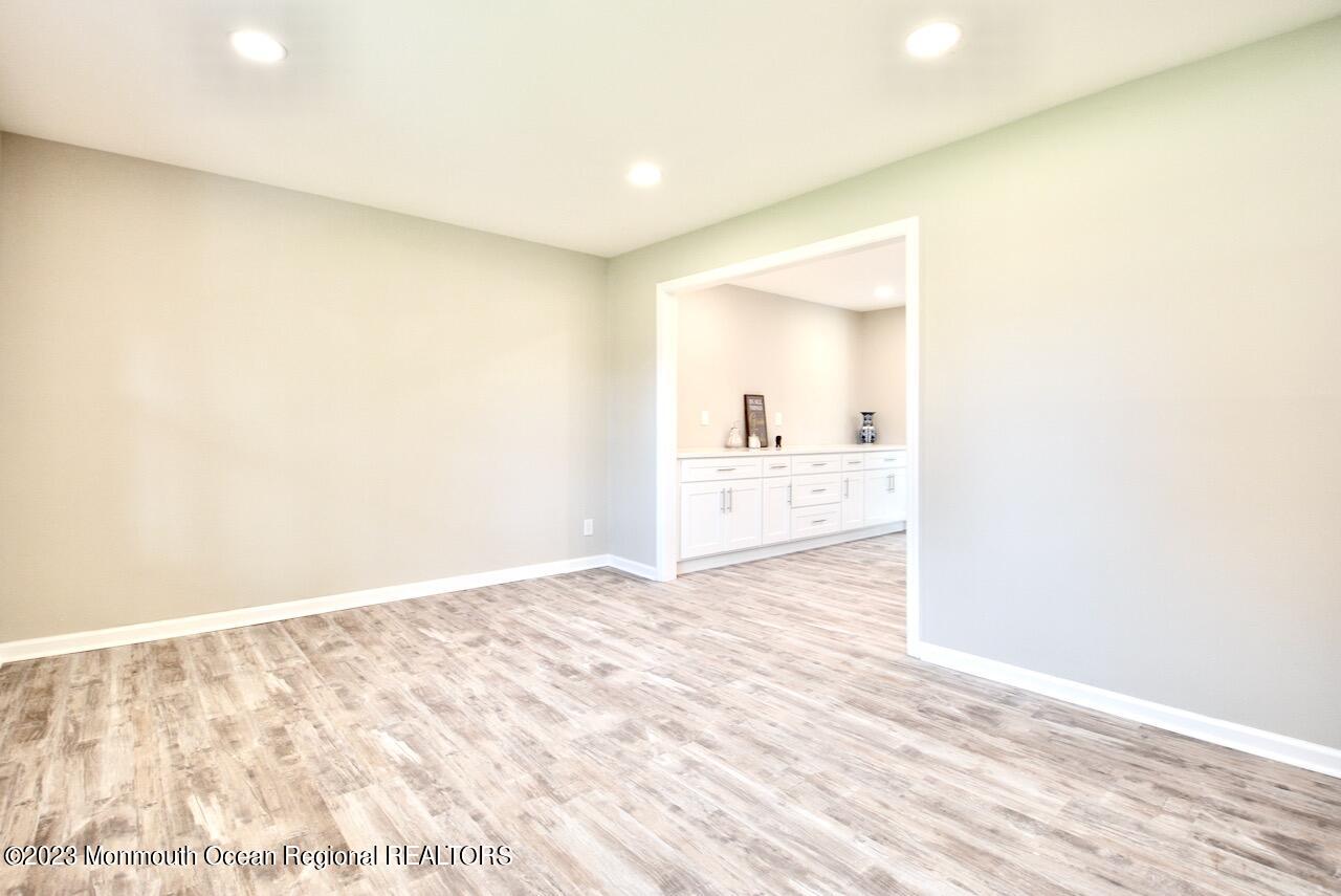 6 Wickatunk Road Manalapan, NJ 07726 - Photo 8 of 35 a view of a kitchen with wooden floor and a sink