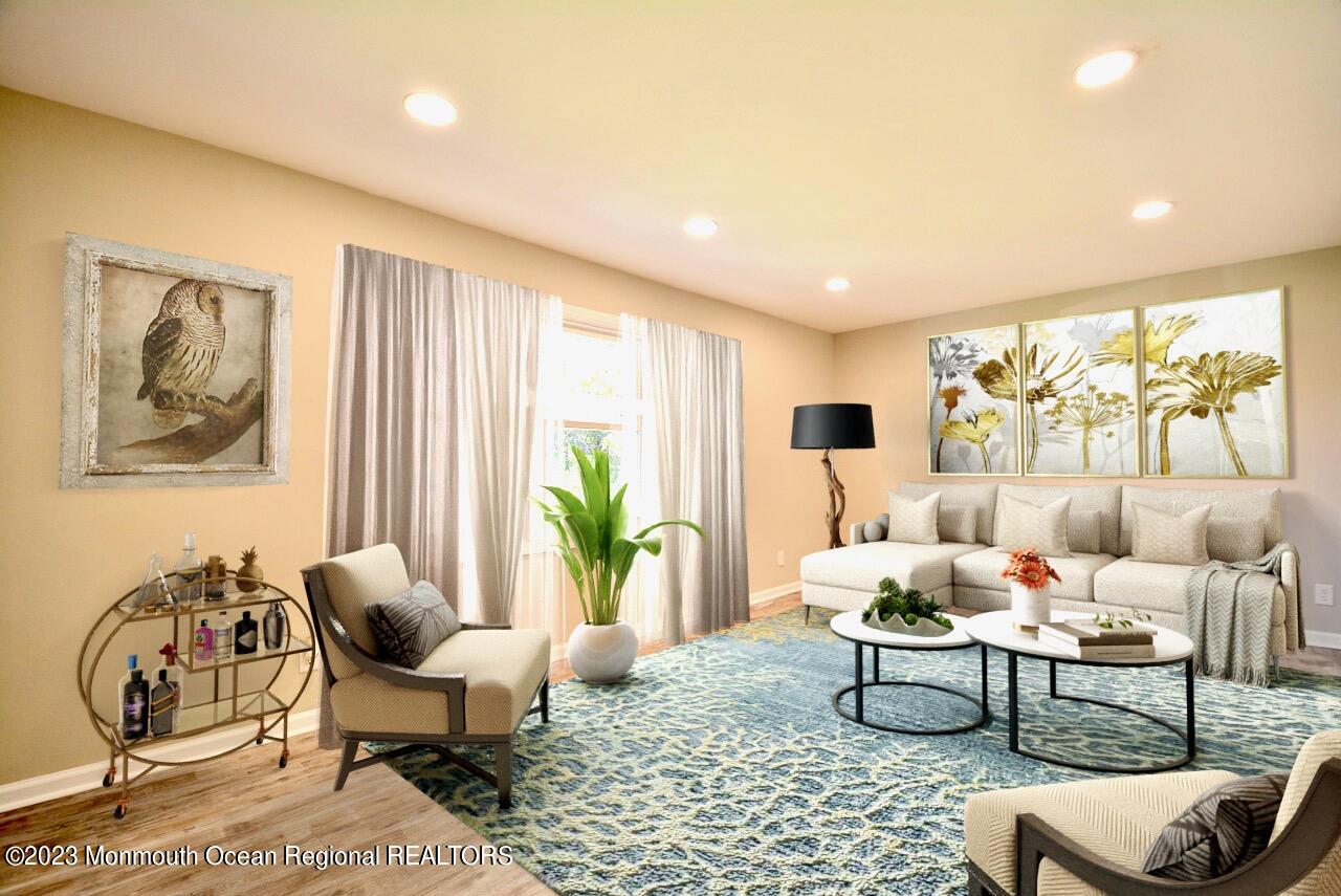 6 Wickatunk Road Manalapan, NJ 07726 - Photo 9 of 35 a living room with furniture and a large window