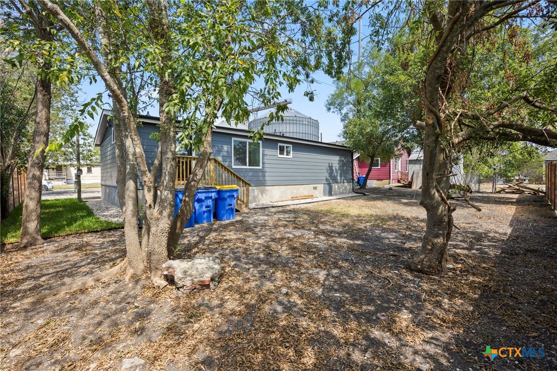 404 East Pecan Street Taylor, TX 76574 - Photo 19 of 19 a view of a road with large trees