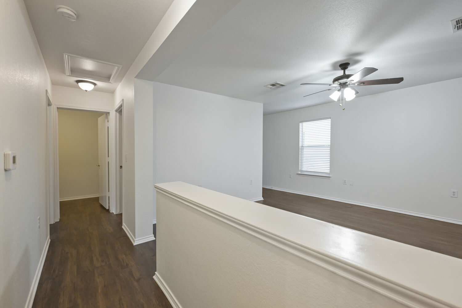 6733 Doyal Drive Austin, TX 78747 - Photo 9 of 28 A central hallway leads to an inviting open living space with ample natural light.