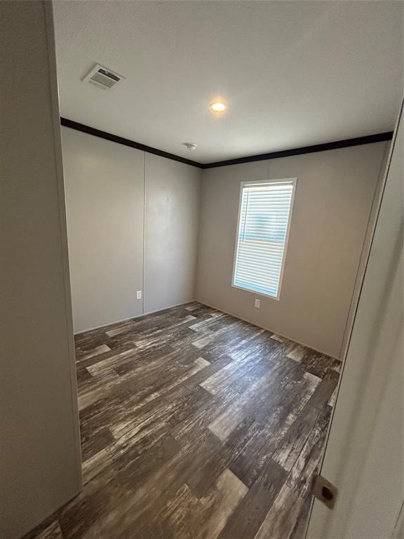 318 Seminole Quitman, TX 75783 - Photo 13 of 36 an empty room with a empty space and windows