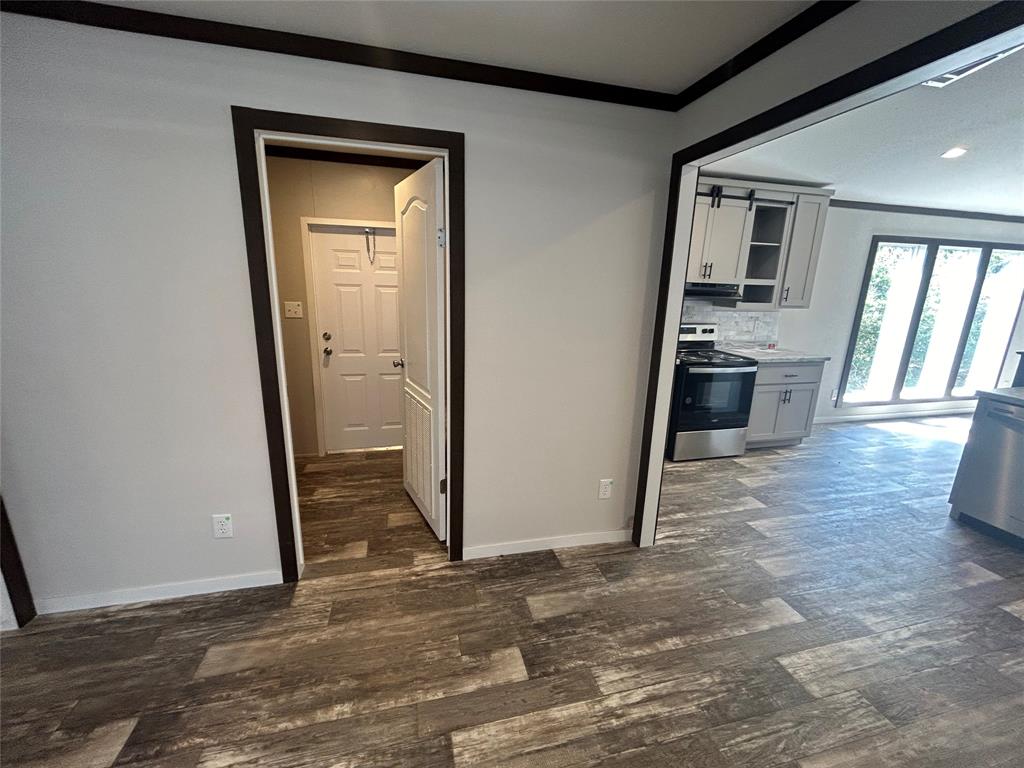 318 Seminole Quitman, TX 75783 - Photo 23 of 36 a view of a kitchen from a hallway