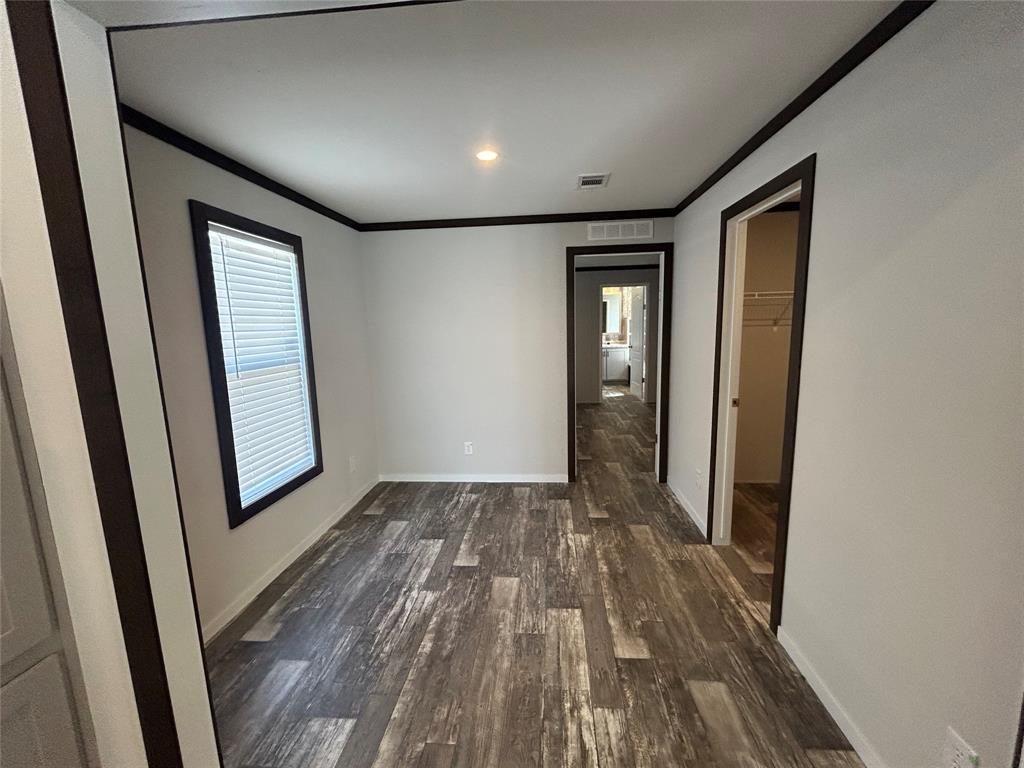 318 Seminole Quitman, TX 75783 - Photo 24 of 36 a view of empty room with wooden floor