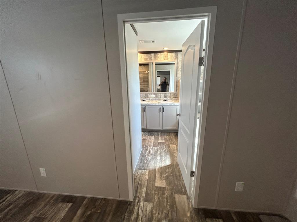 318 Seminole Quitman, TX 75783 - Photo 28 of 36 a bathroom with a sink and a mirror
