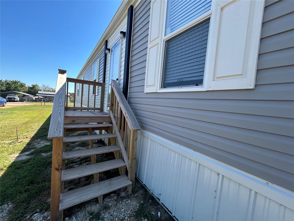 318 Seminole Quitman, TX 75783 - Photo 6 of 36 a view of a balcony with stairs and wooden floor