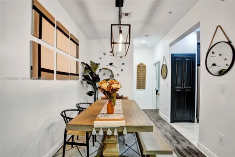 a view of a hallway with furniture and entryway