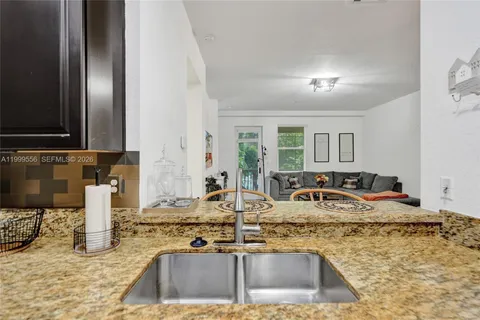 a bedroom with a bed lamps and a fireplace