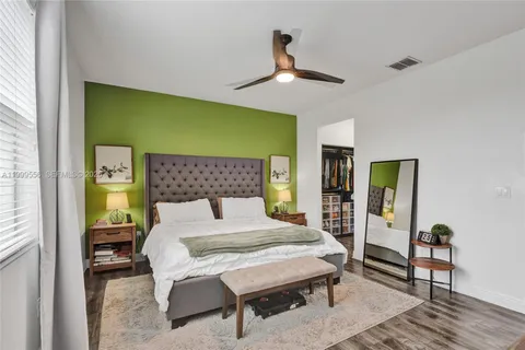 a bedroom with a bed and dresser