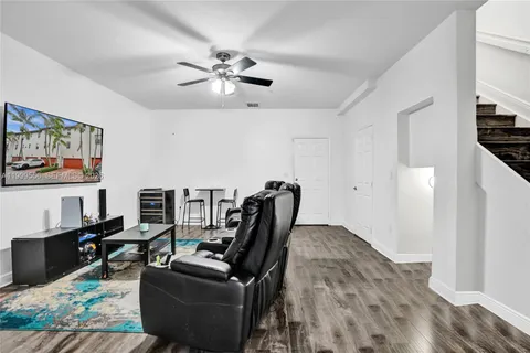 a view of a livingroom with furniture and workspace