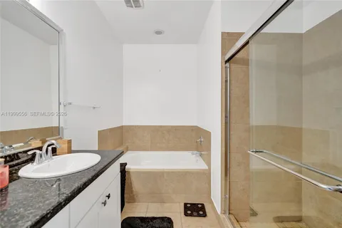 a bathroom with a sink double vanity and a mirror