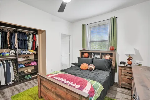 a bathroom with a granite countertop sink and a mirror a bathtub
