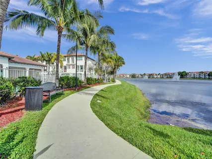 a view of a lake with houses in the back