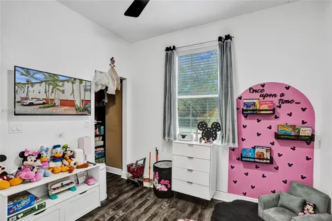 a bedroom with furniture and a window