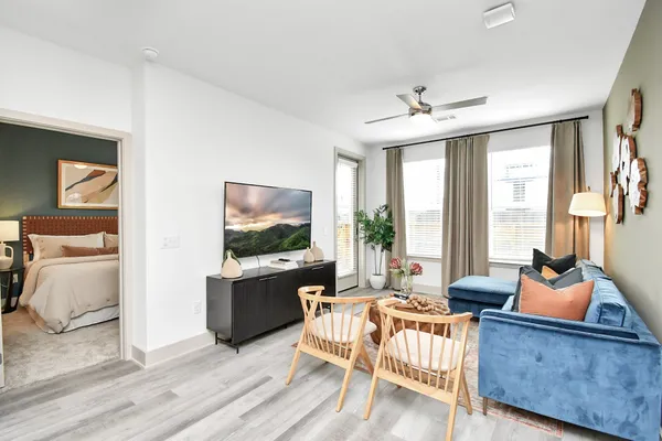 a living room with furniture and a flat screen tv