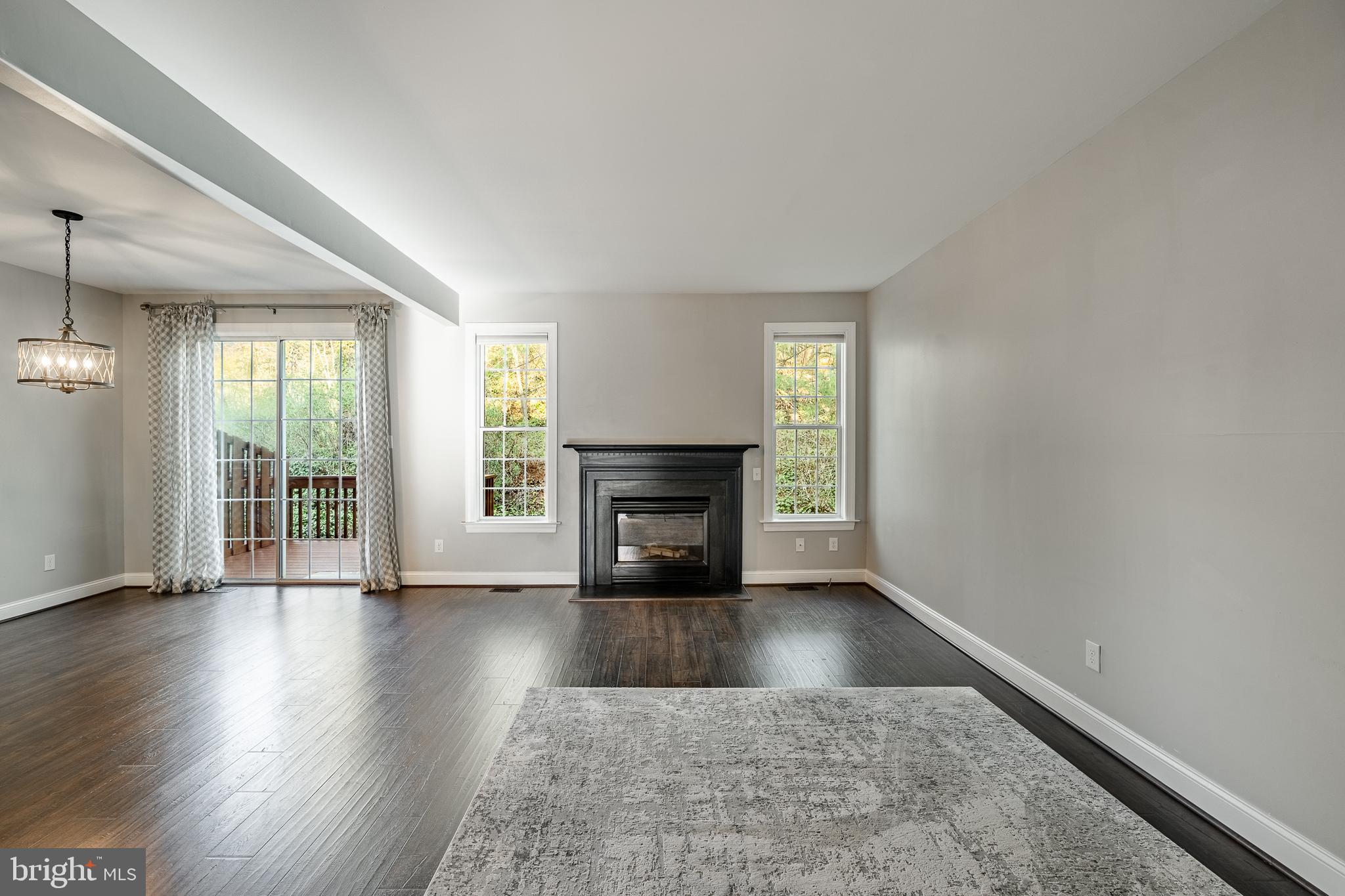 112 Federal Walk Kennett Square, PA 19348 - Photo 13 of 54 an empty room with wooden floor fireplace and windows