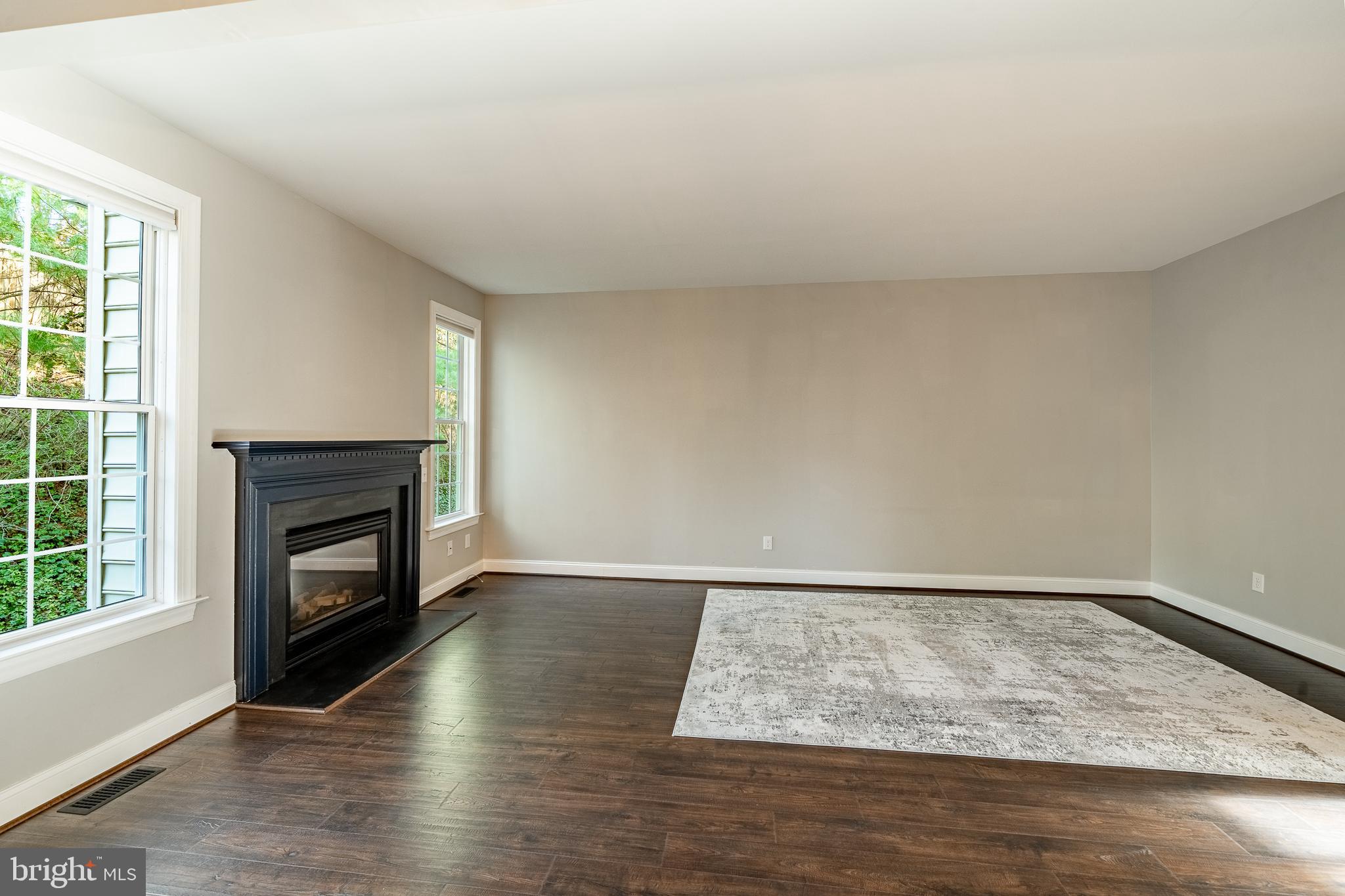112 Federal Walk Kennett Square, PA 19348 - Photo 14 of 54 a view of an empty room with wooden floor fireplace and a window