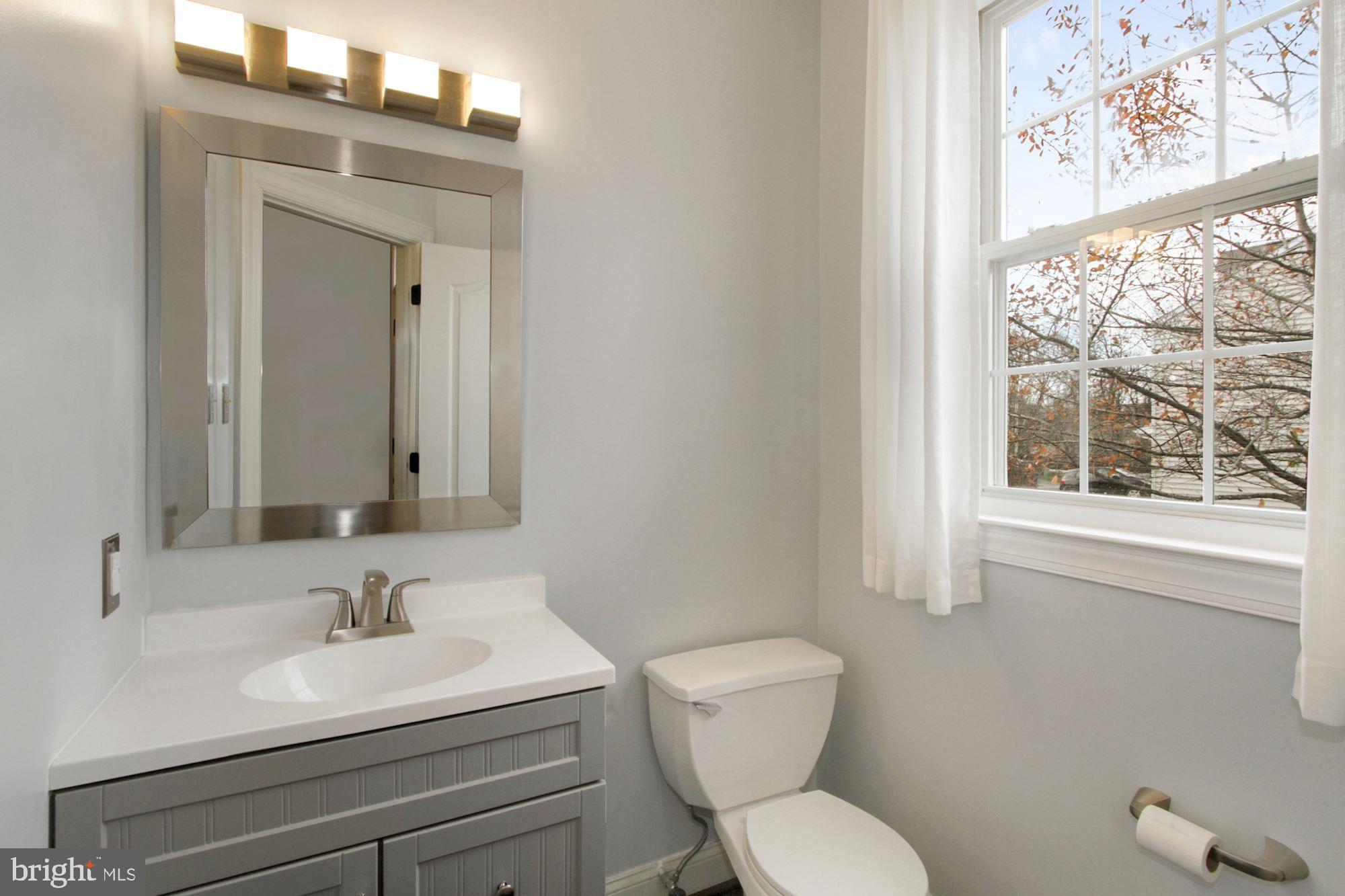 112 Federal Walk Kennett Square, PA 19348 - Photo 16 of 54 a bathroom with a toilet sink and mirror