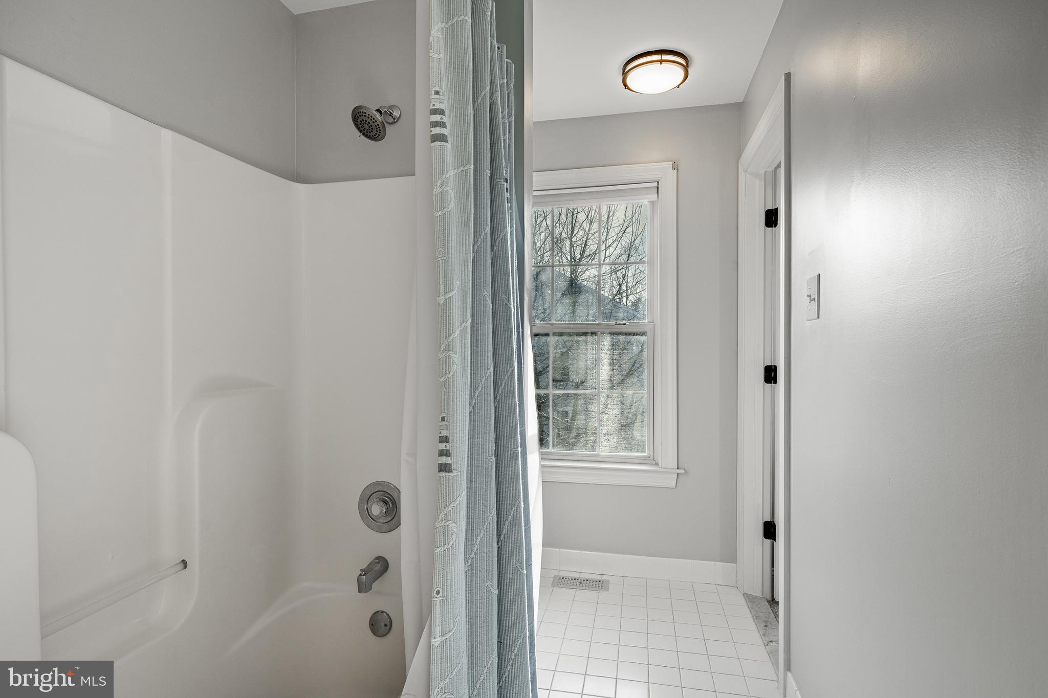 112 Federal Walk Kennett Square, PA 19348 - Photo 38 of 54 a bathroom with a shower and a mirror