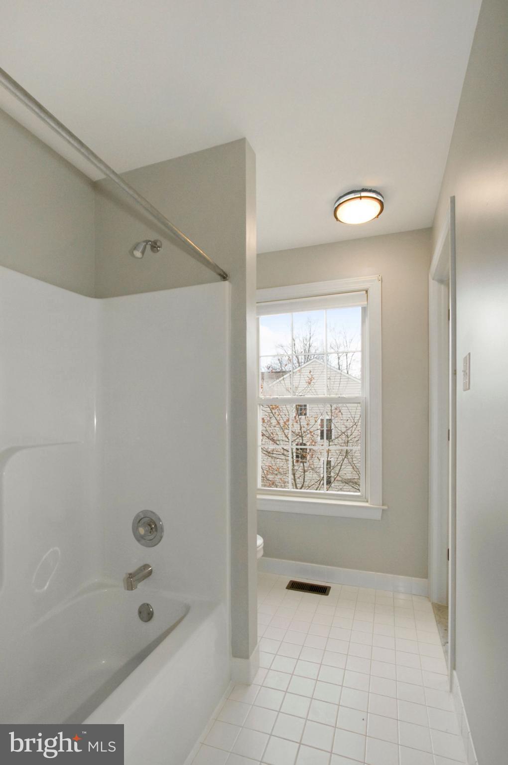 112 Federal Walk Kennett Square, PA 19348 - Photo 39 of 54 a bathroom with a bathtub and shower