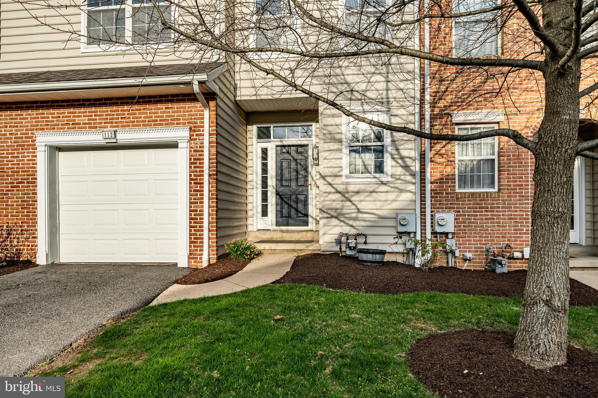 112 Federal Walk Kennett Square, PA 19348 - Photo 51 of 54 a front view of a house with a yard and garage