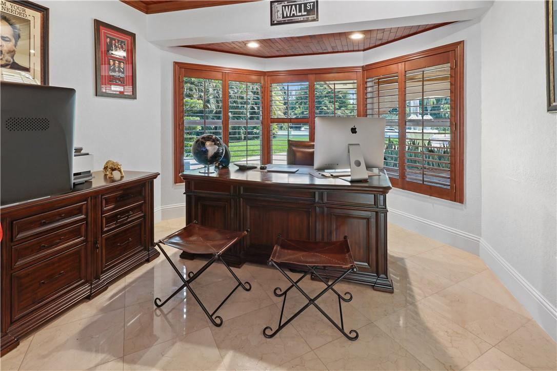 14540 Southwest 63rd Street Southwest Ranches, FL 33330 - Photo 12 of 69 a dining room with a table and chairs
