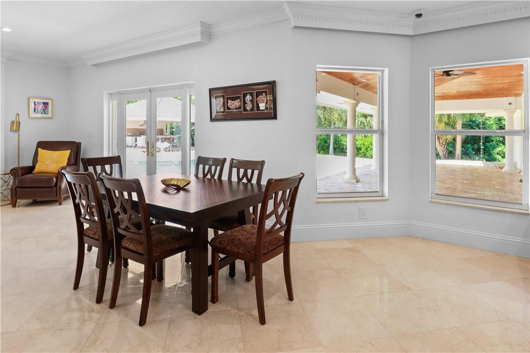 14540 Southwest 63rd Street Southwest Ranches, FL 33330 - Photo 32 of 69 a view of a dining room with furniture and a window