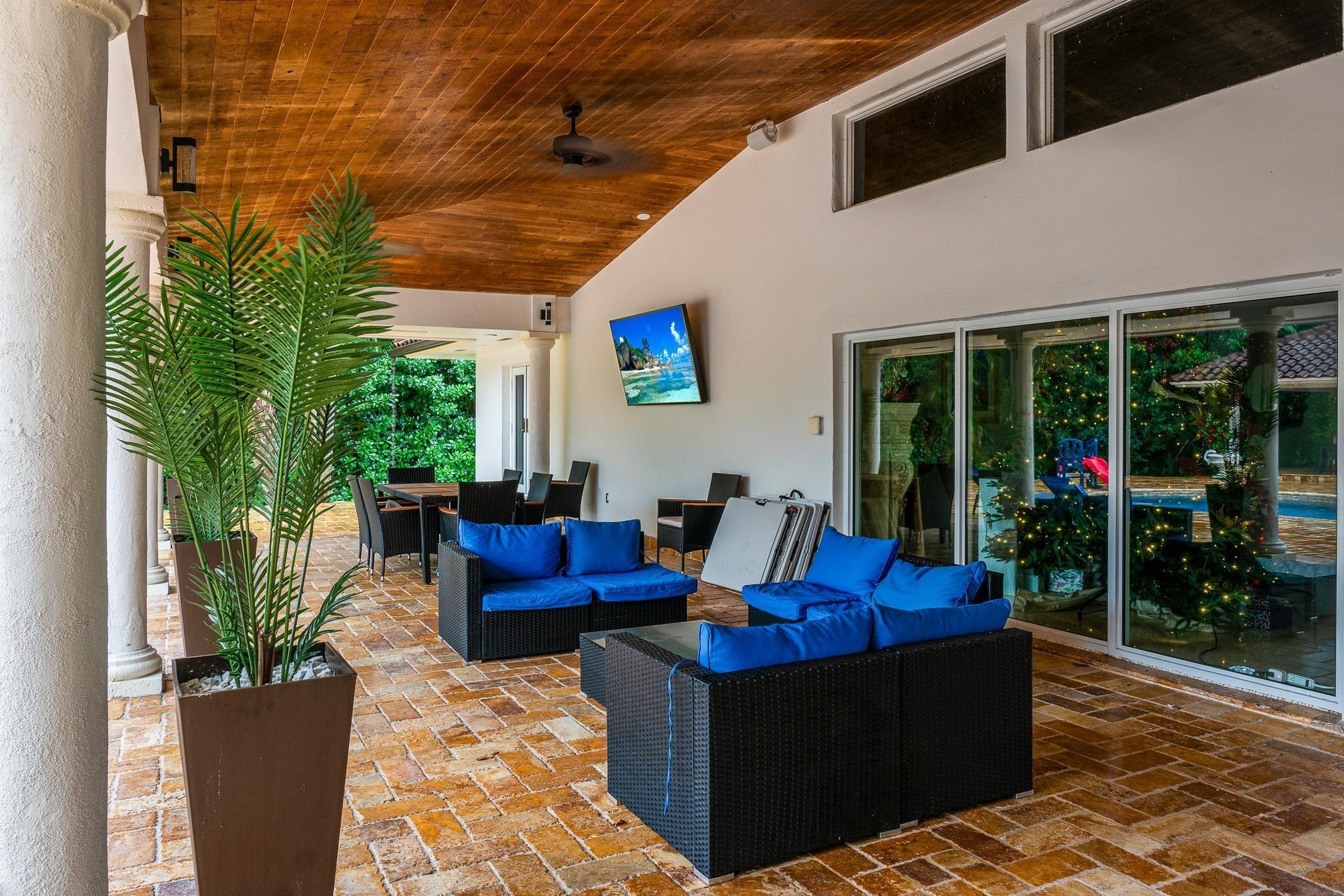 14540 Southwest 63rd Street Southwest Ranches, FL 33330 - Photo 58 of 69 a outdoor space with patio the couches and a dining table with garden view