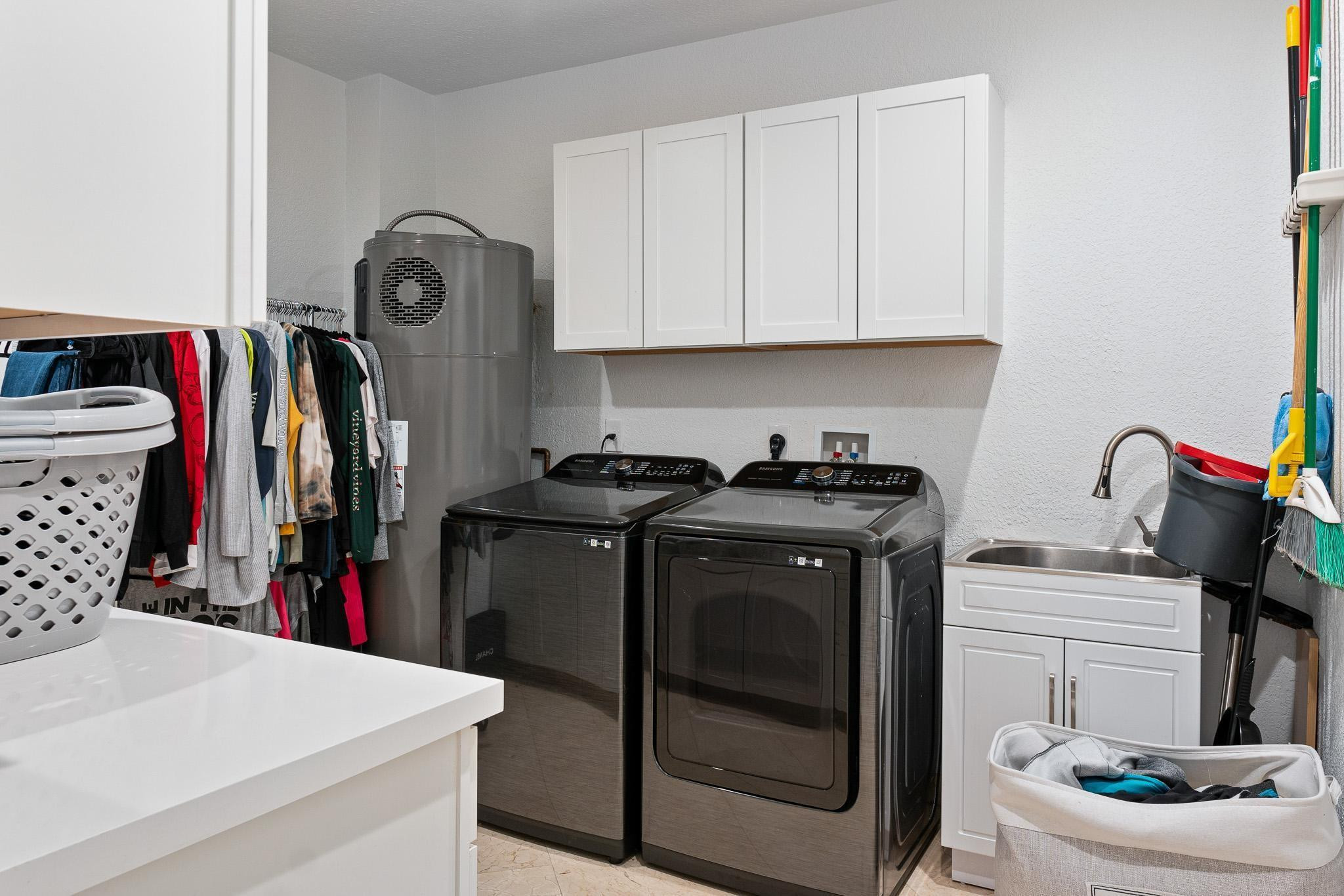 14540 Southwest 63rd Street Southwest Ranches, FL 33330 - Photo 67 of 69 a utility room with dryer and washer