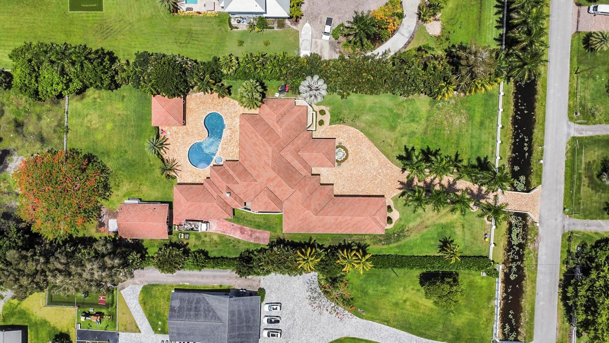 14540 Southwest 63rd Street Southwest Ranches, FL 33330 - Photo 7 of 69 an aerial view of house with yard swimming pool and outdoor seating