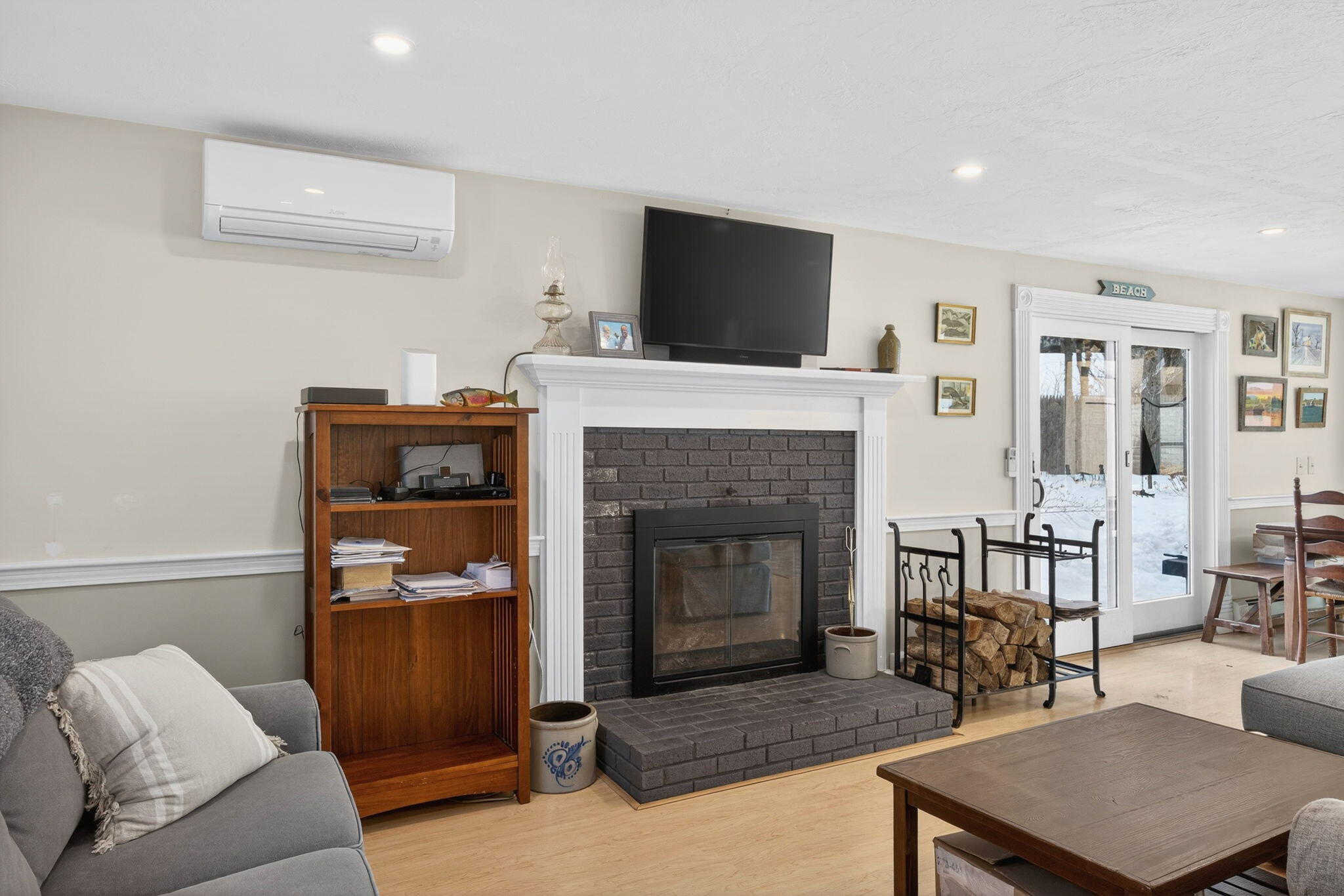 171 Weir Road Yarmouth Port, MA 02675 - Photo 12 of 53 a living room with furniture and a fireplace