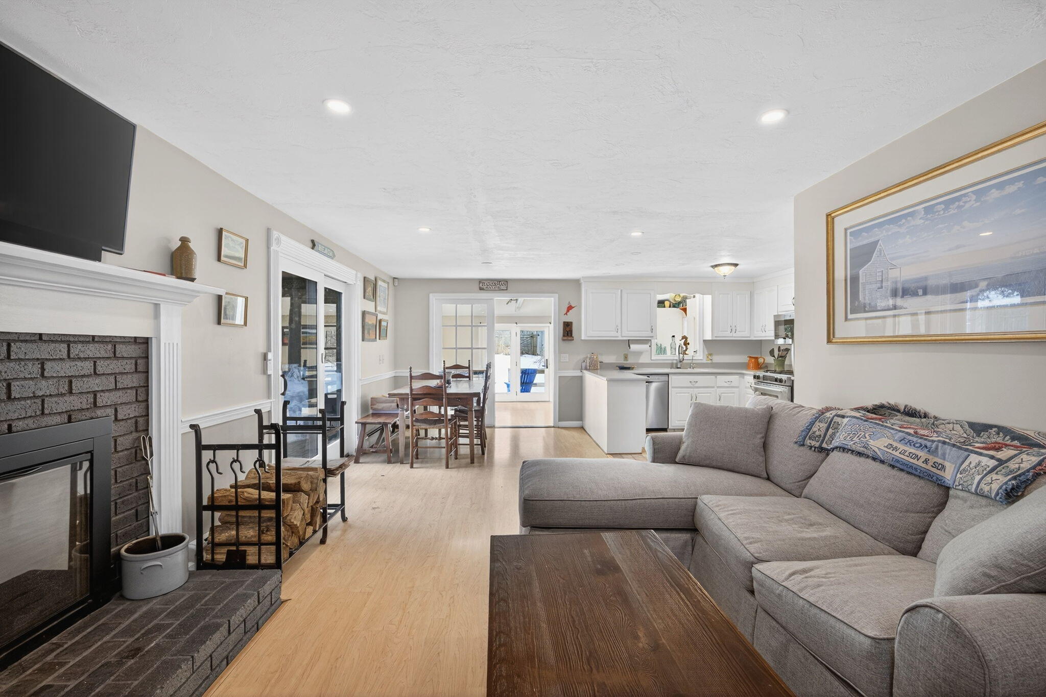 171 Weir Road Yarmouth Port, MA 02675 - Photo 13 of 53 a living room with furniture and a fireplace