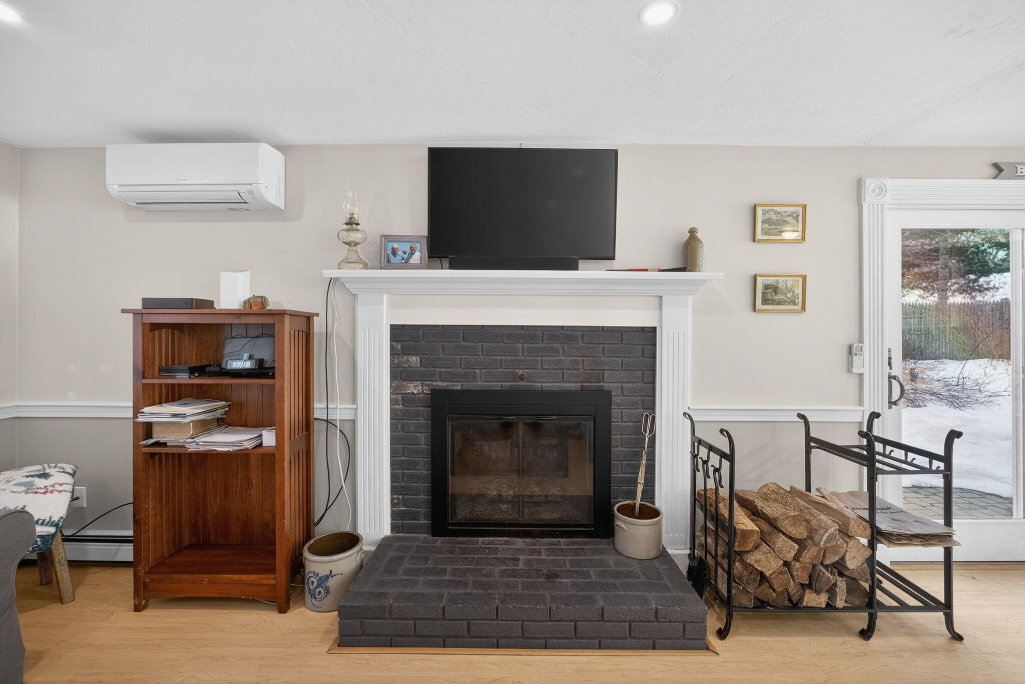 171 Weir Road Yarmouth Port, MA 02675 - Photo 18 of 53 a living room with furniture and a fireplace