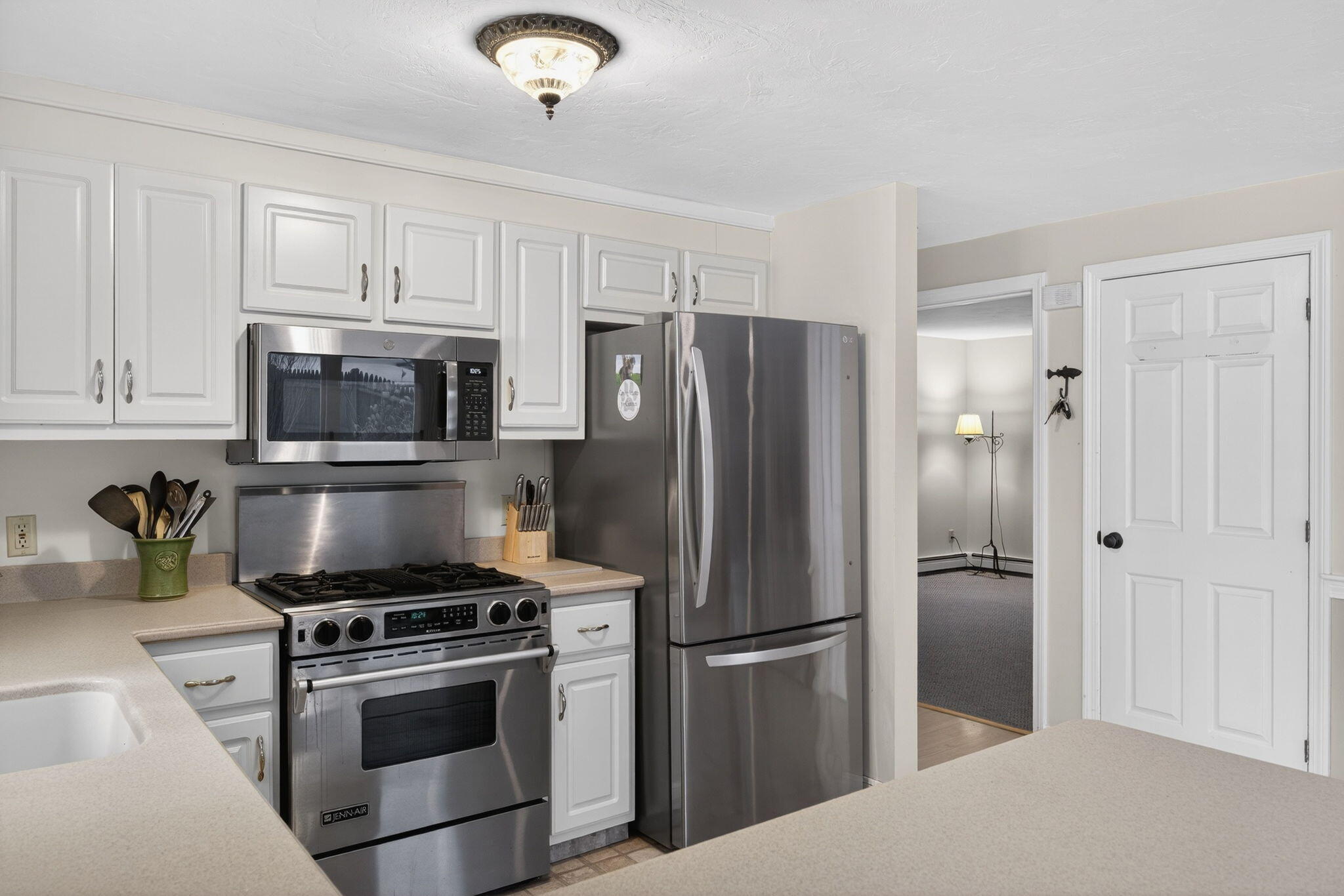 171 Weir Road Yarmouth Port, MA 02675 - Photo 19 of 53 a kitchen with stainless steel appliances and granite countertop a refrigerator