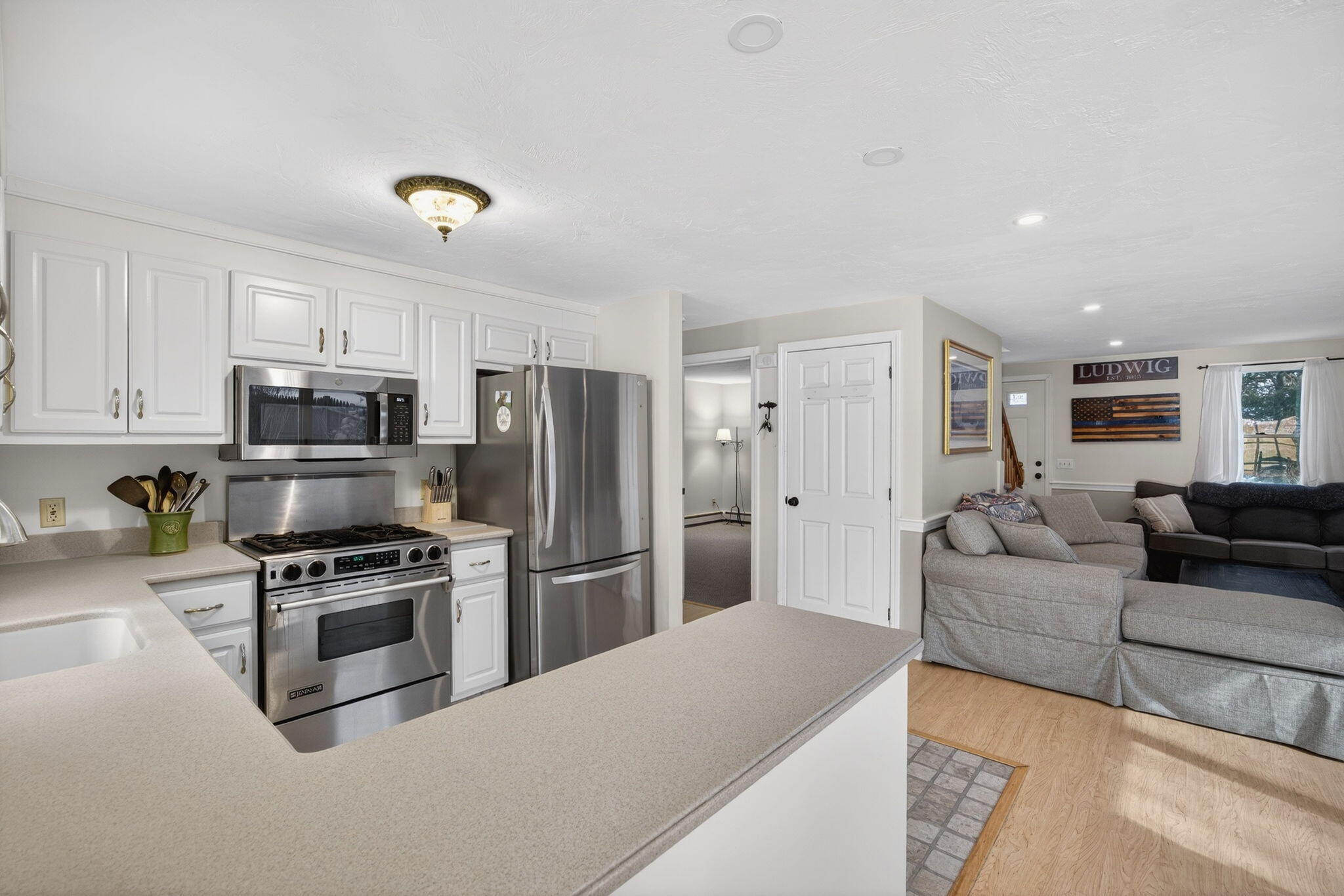 171 Weir Road Yarmouth Port, MA 02675 - Photo 20 of 53 a living room with stainless steel appliances furniture a refrigerator and a sink