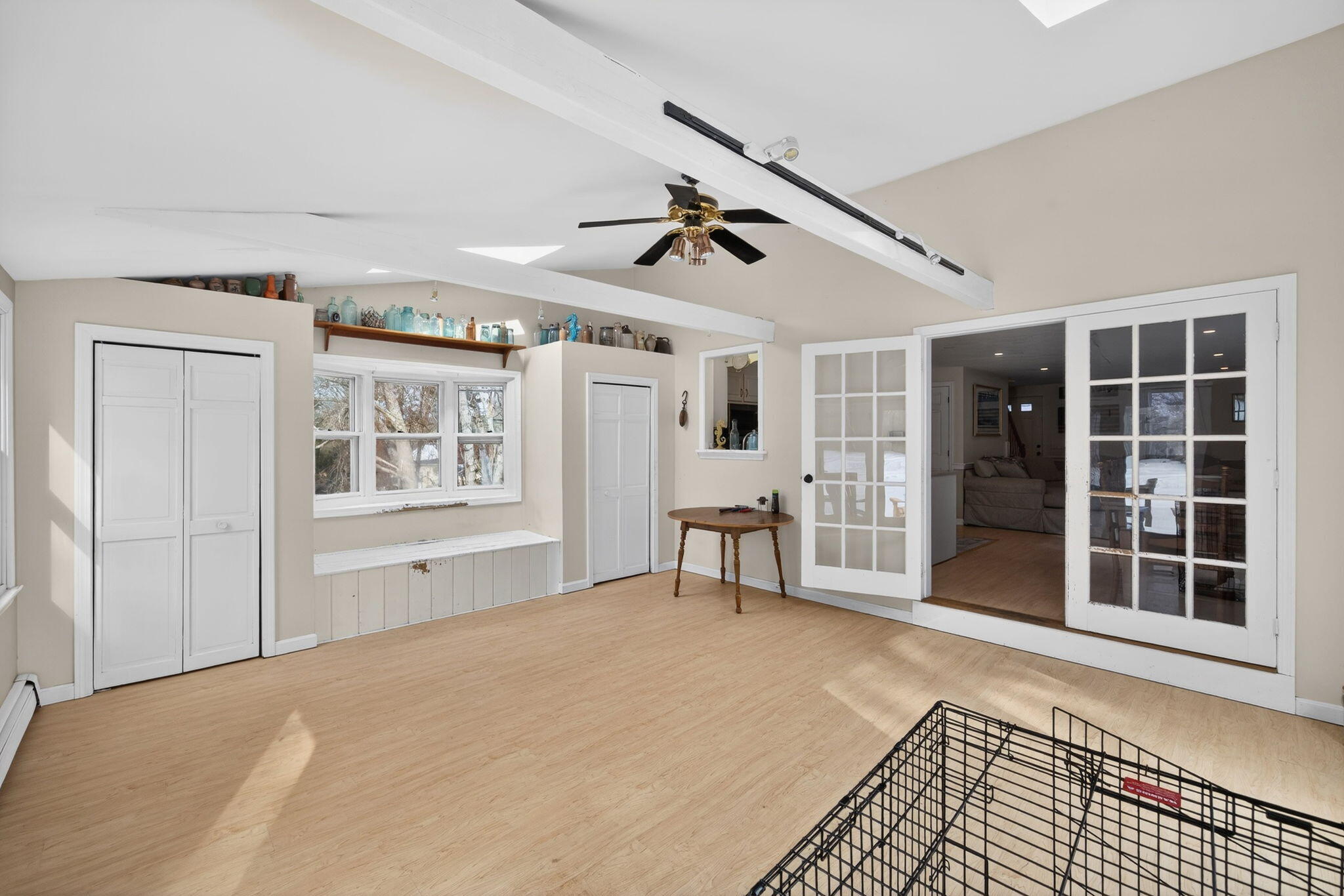 171 Weir Road Yarmouth Port, MA 02675 - Photo 25 of 53 a view of a livingroom with wooden floor and a ceiling fan