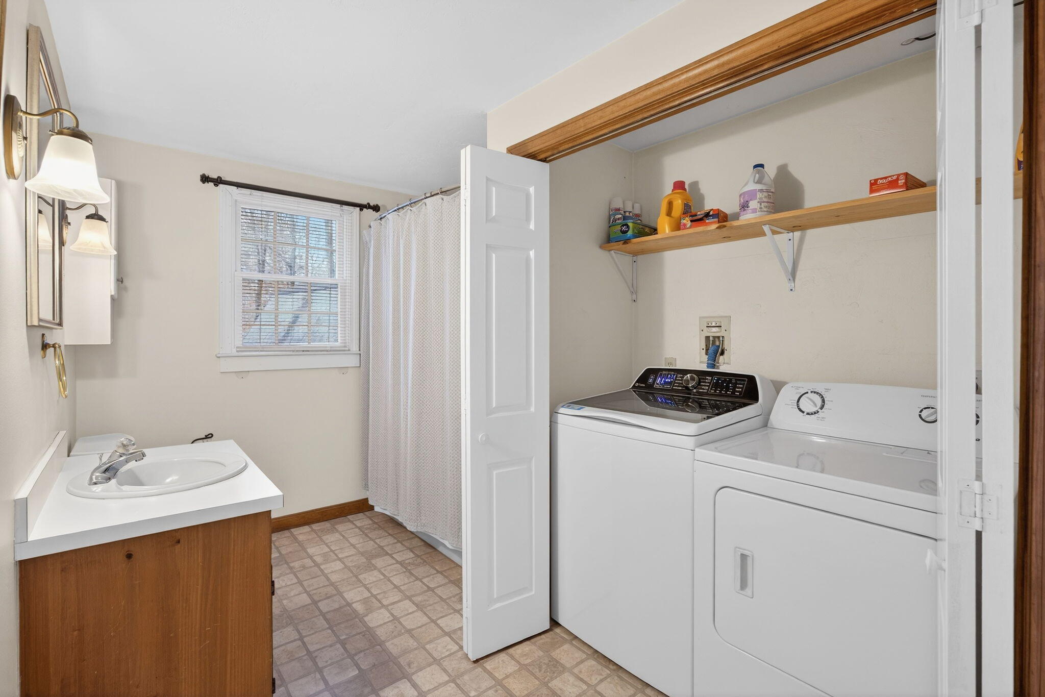 171 Weir Road Yarmouth Port, MA 02675 - Photo 34 of 53 a view of storage and utility room with washer and dryer
