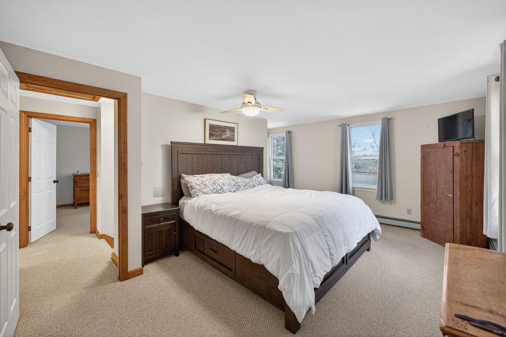 171 Weir Road Yarmouth Port, MA 02675 - Photo 37 of 53 a bedroom with a bed and a refrigerator