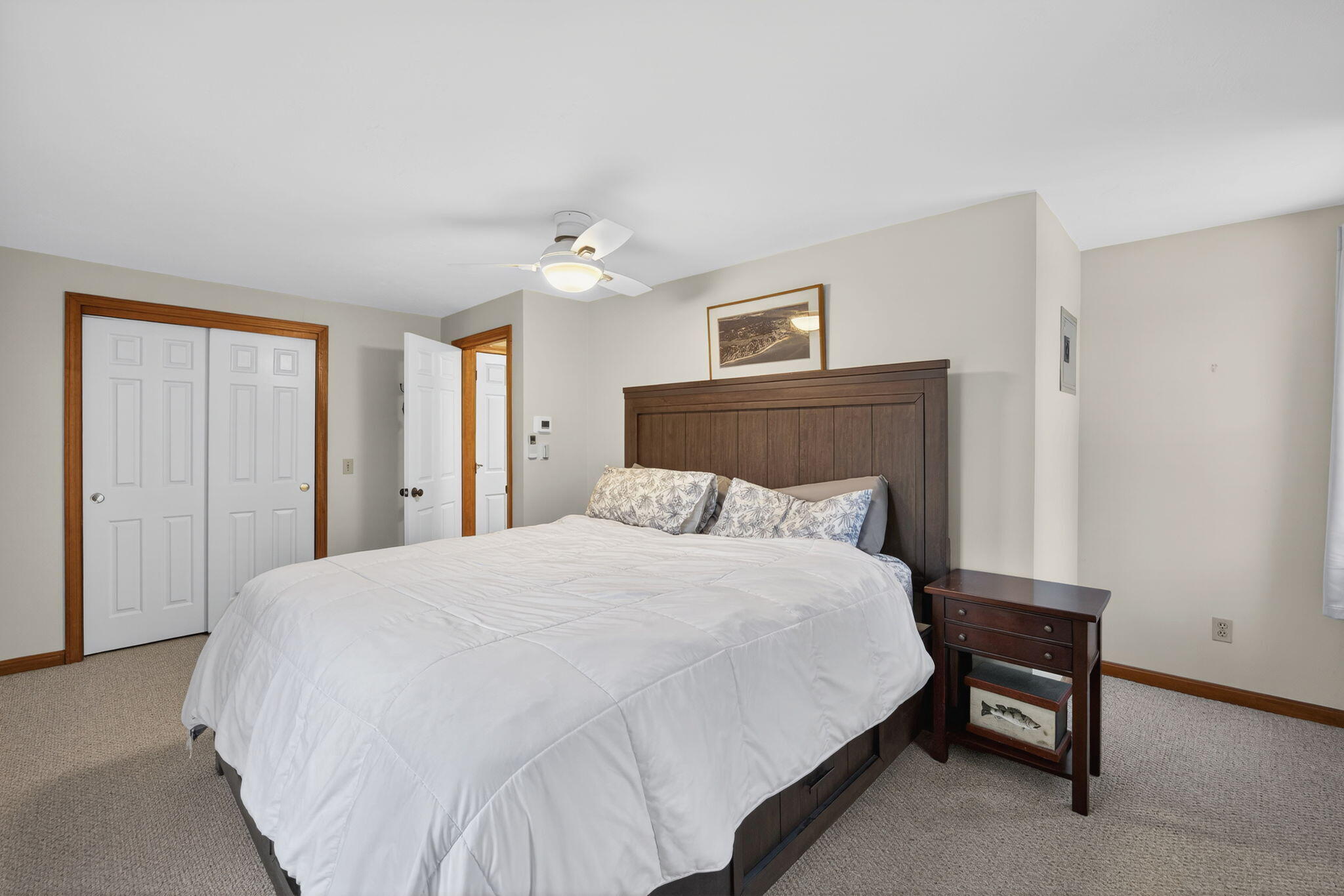 171 Weir Road Yarmouth Port, MA 02675 - Photo 38 of 53 a large bed sitting in a bedroom and a table