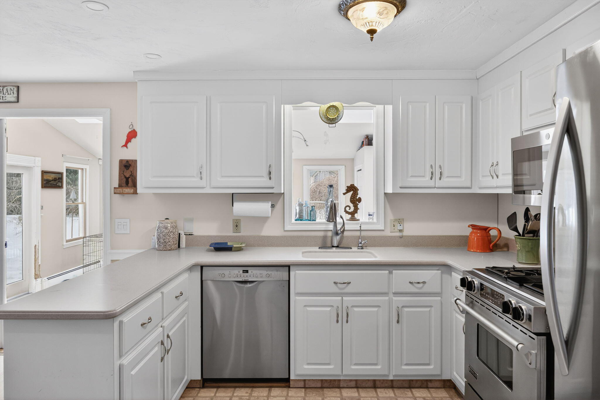 171 Weir Road Yarmouth Port, MA 02675 - Photo 5 of 53 a kitchen with stainless steel appliances granite countertop a sink a stove and cabinets