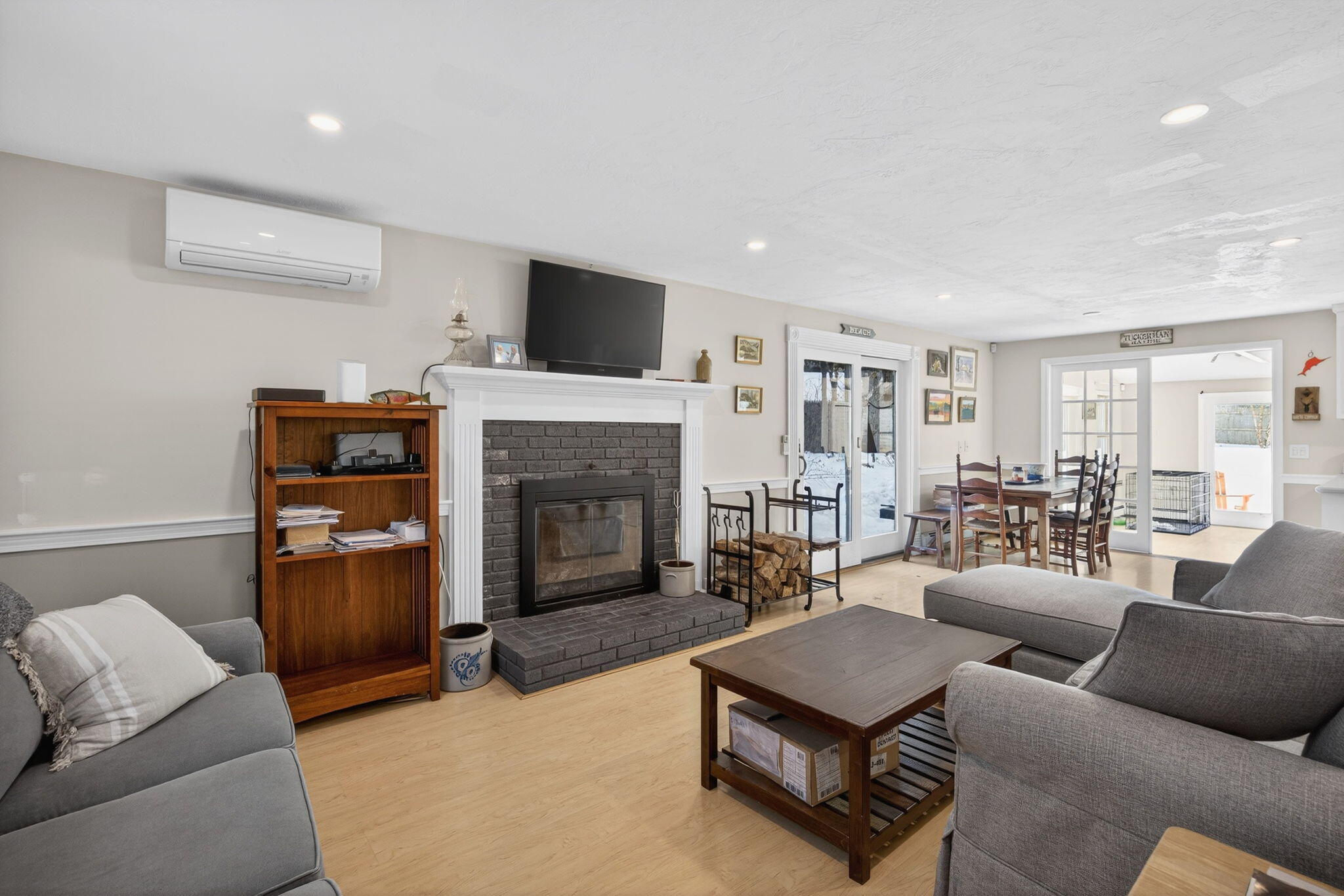 171 Weir Road Yarmouth Port, MA 02675 - Photo 10 of 53 a living room with furniture and a fireplace