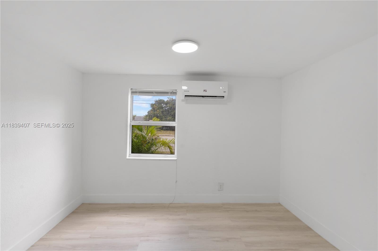 607 Southwest 3rd Street, Unit 1 Delray Beach, FL 33444 - Photo 17 of 27 an empty room with a window