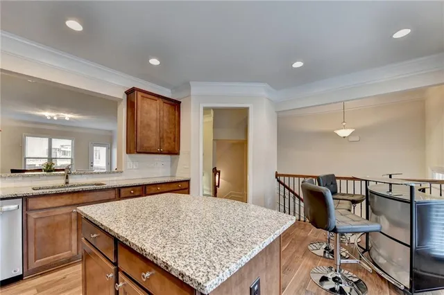 a bathroom with a granite countertop toilet sink and mirror