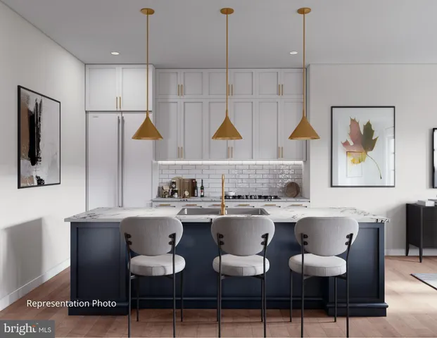 a kitchen with a dining table and chairs