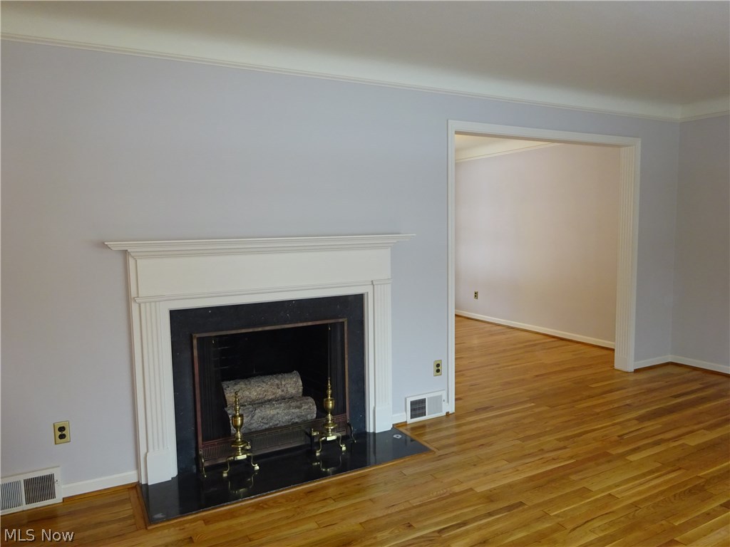 2927 Weymouth Road Cleveland, OH 44120 - Photo 5 of 29 The living room also has a fireplace and fresh paint.