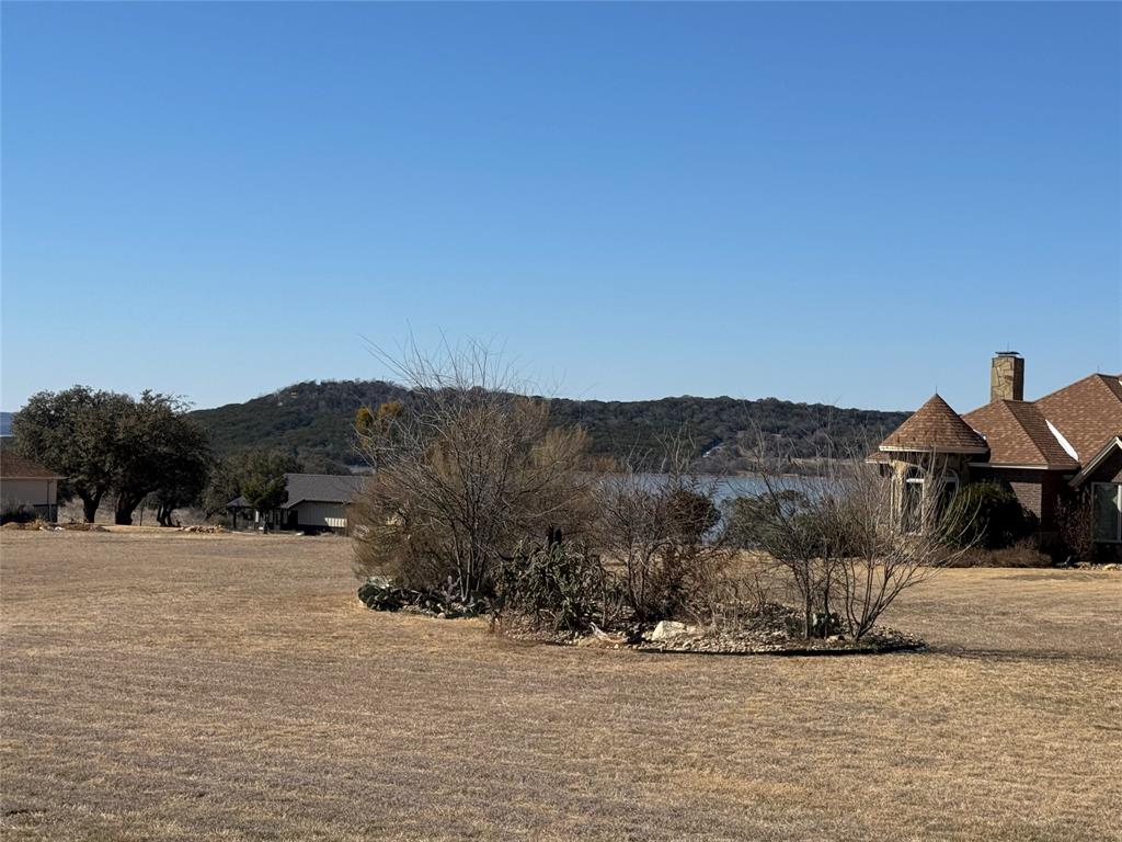 Lot 1049 Frog Branch Graford, TX 76449 - Photo 4 of 14 a view of a house with a yard