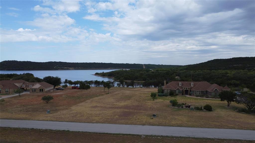 Lot 1049 Frog Branch Graford, TX 76449 - Photo 9 of 14 a view of a town with mountains in the background