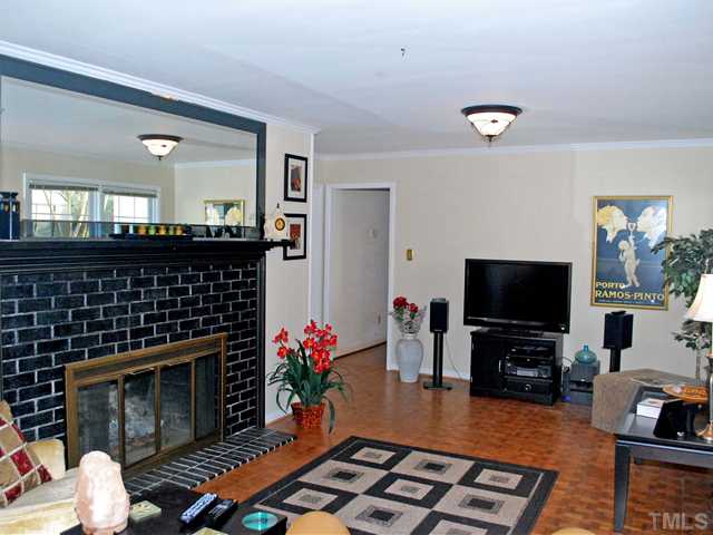 5013 Dantree Place Raleigh, NC 27609 - Photo 3 of 18 Family Room w/ Hardwoods & Fireplace